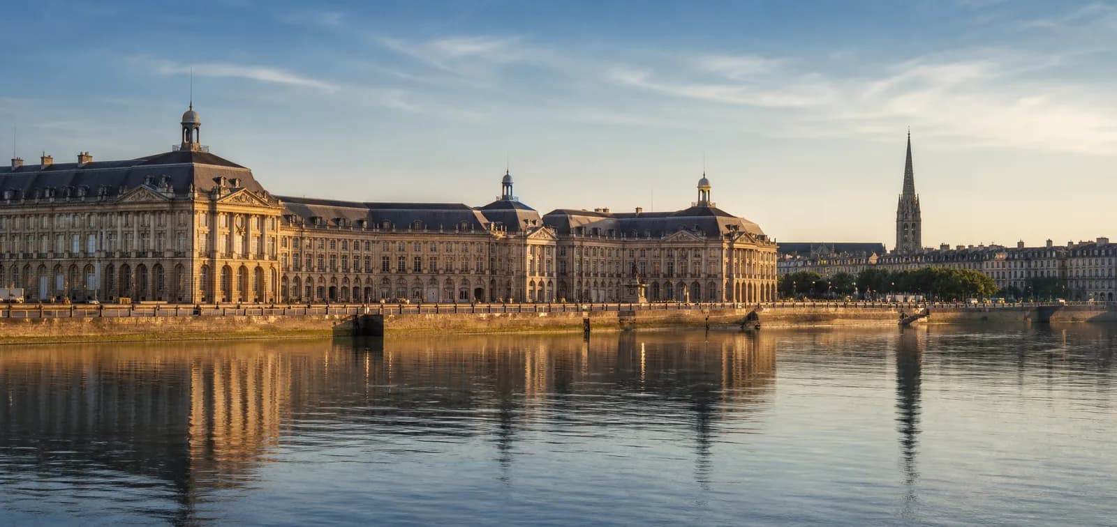 Place de la Bourse reflected beside the Garonne river in Bordeaux