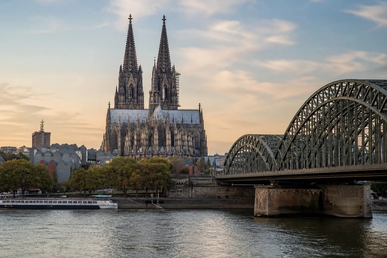 Cologne Cathedral and the Hohenzollern Bridge beside the Rhine