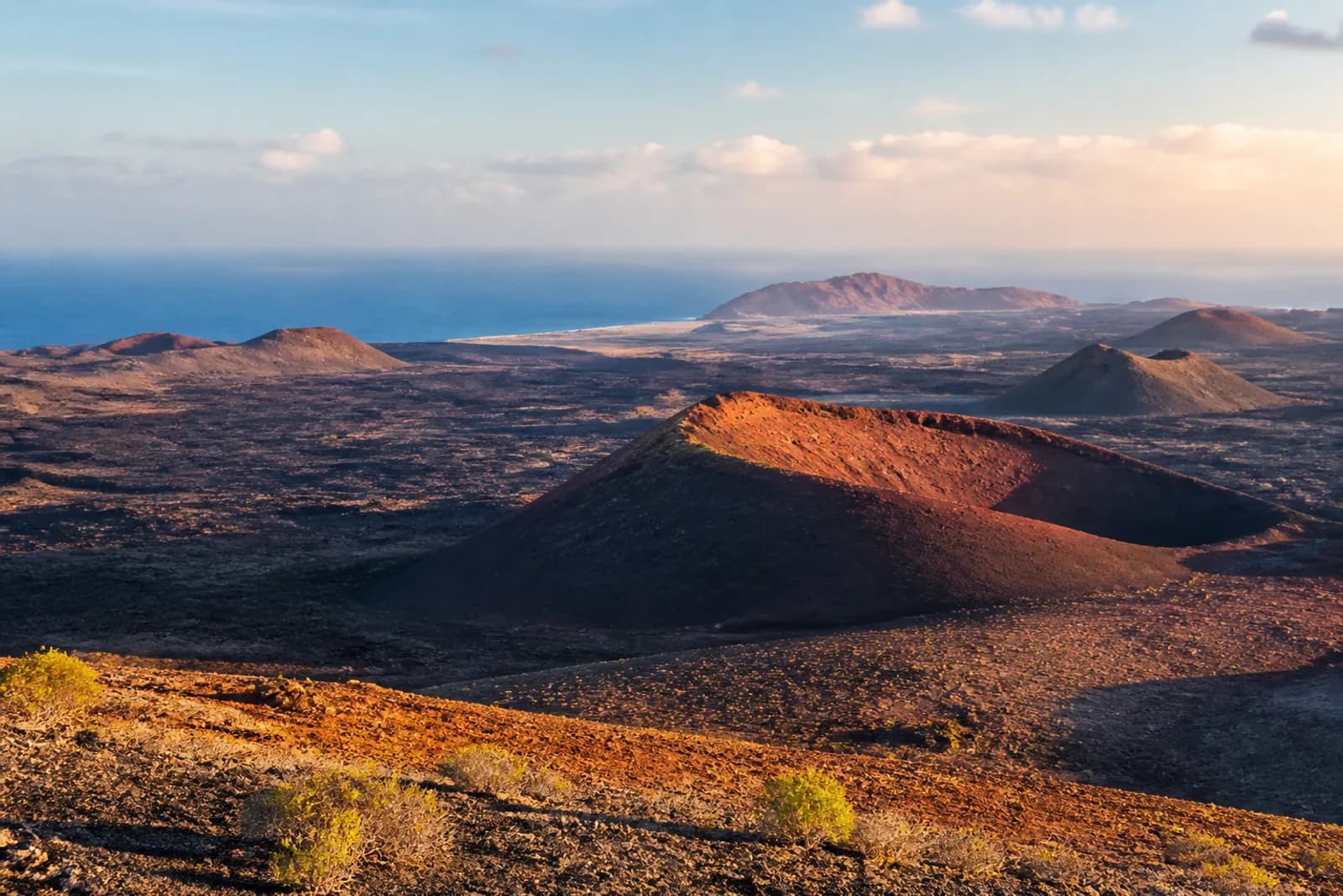 Lanzarote volcanic cones and black lava fields above the Atlantic