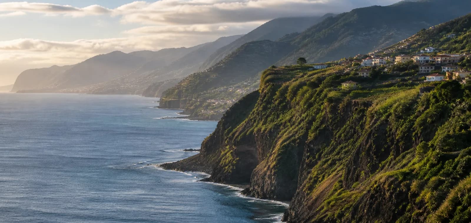 Madeira’s green volcanic cliffs descending to the Atlantic coast