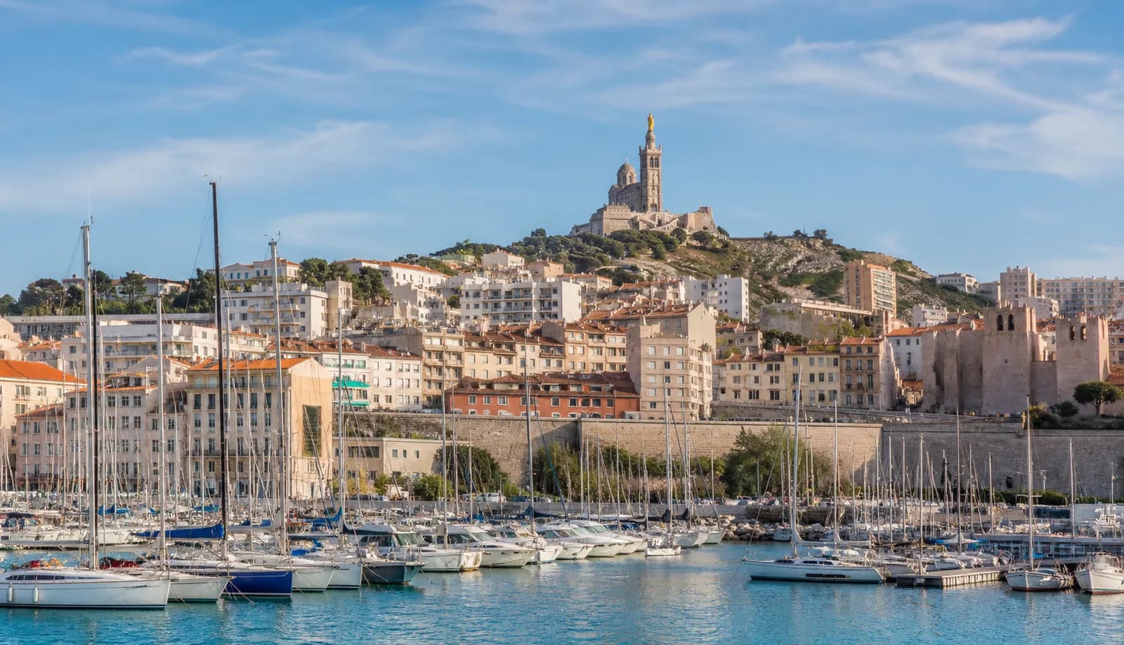 Marseille Old Port with Notre-Dame de la Garde above the harbour