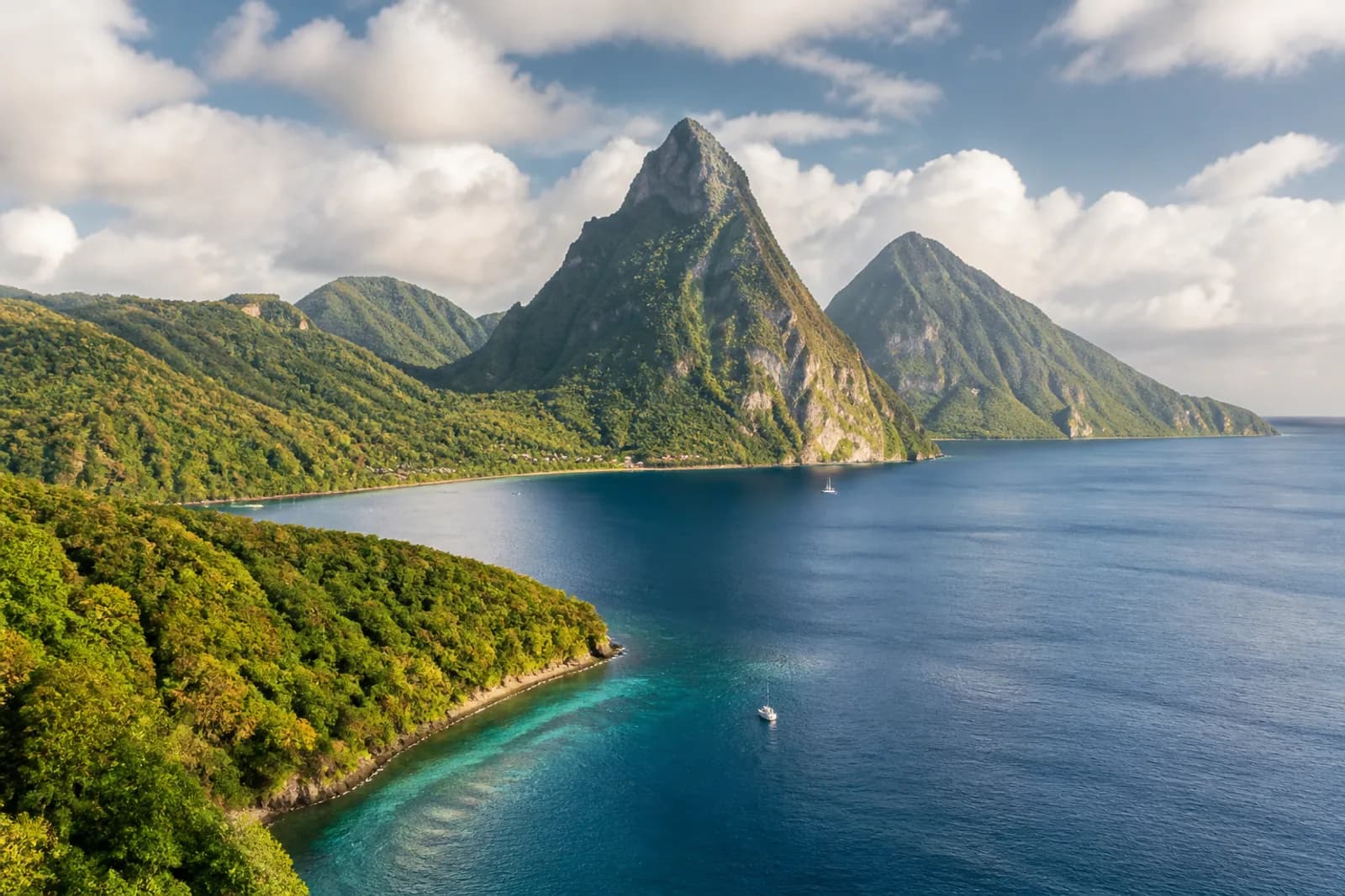 Saint Lucia Pitons rising above a lush Caribbean bay and turquoise water