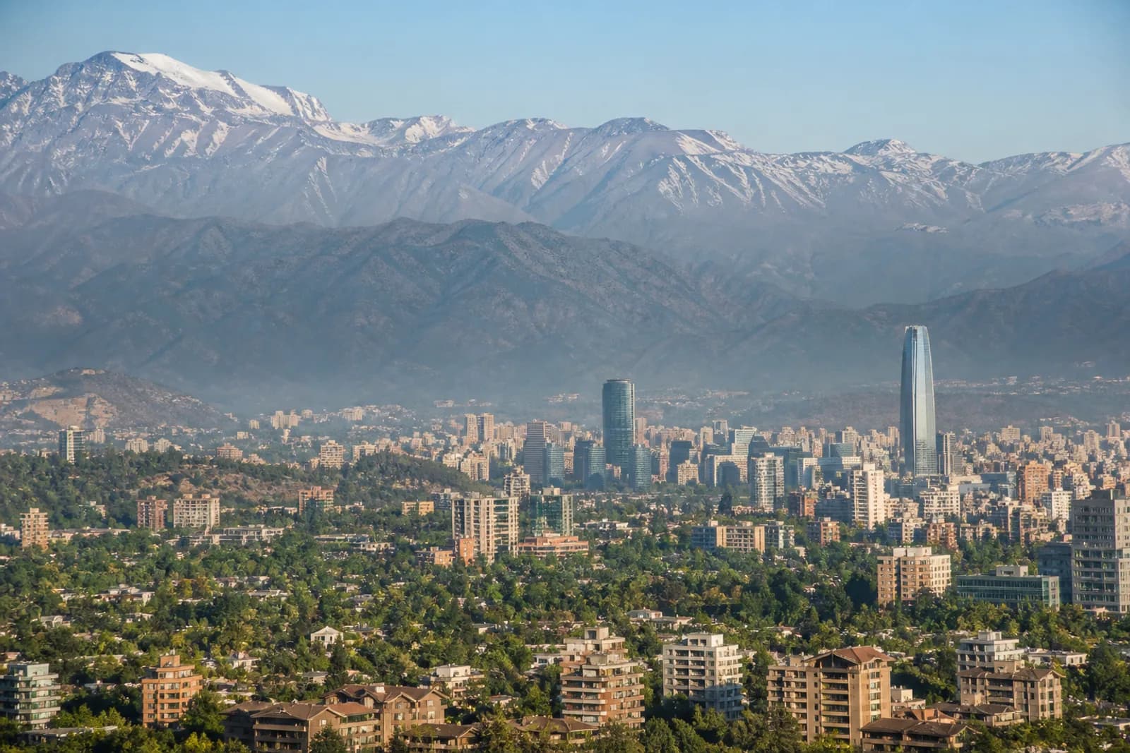 Santiago skyline and leafy districts below the snow-capped Andes