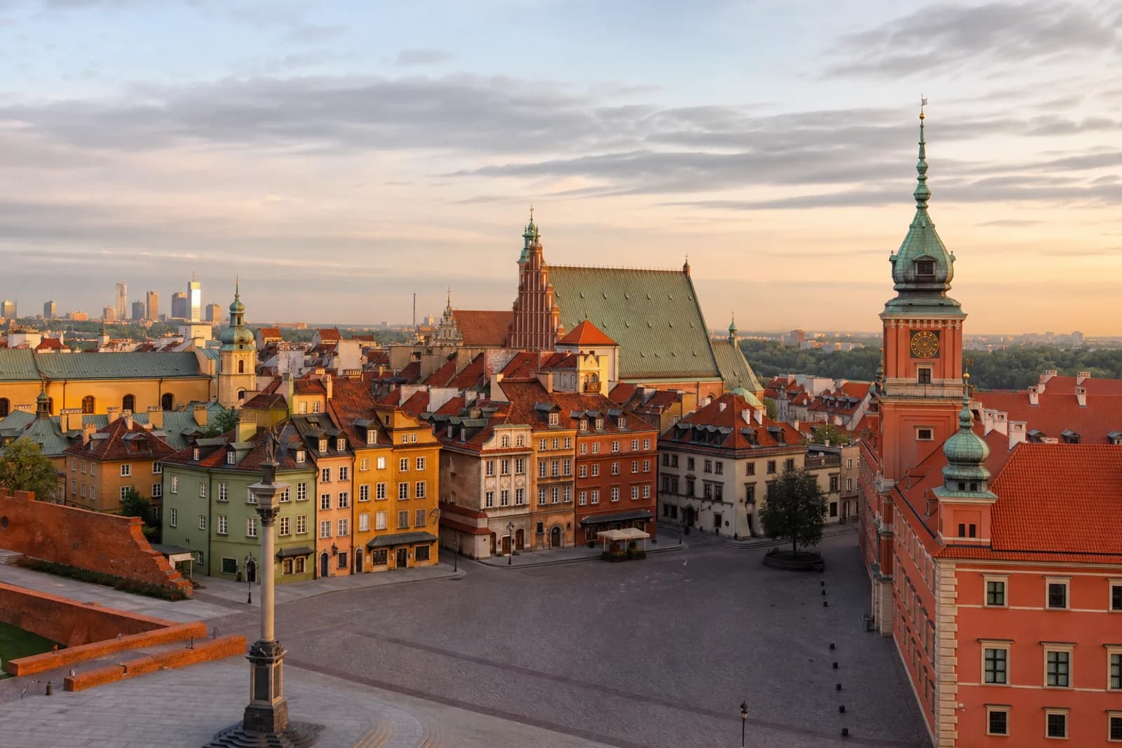 Warsaw Old Town and Royal Castle rooftops with the modern skyline beyond